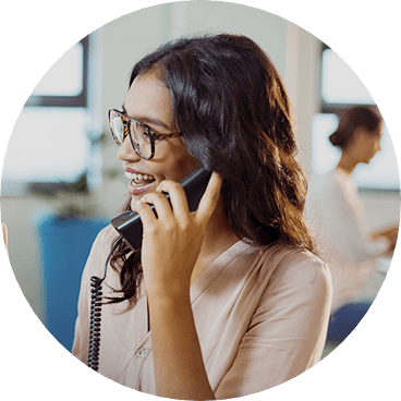 Woman speaking on the phone while smiling